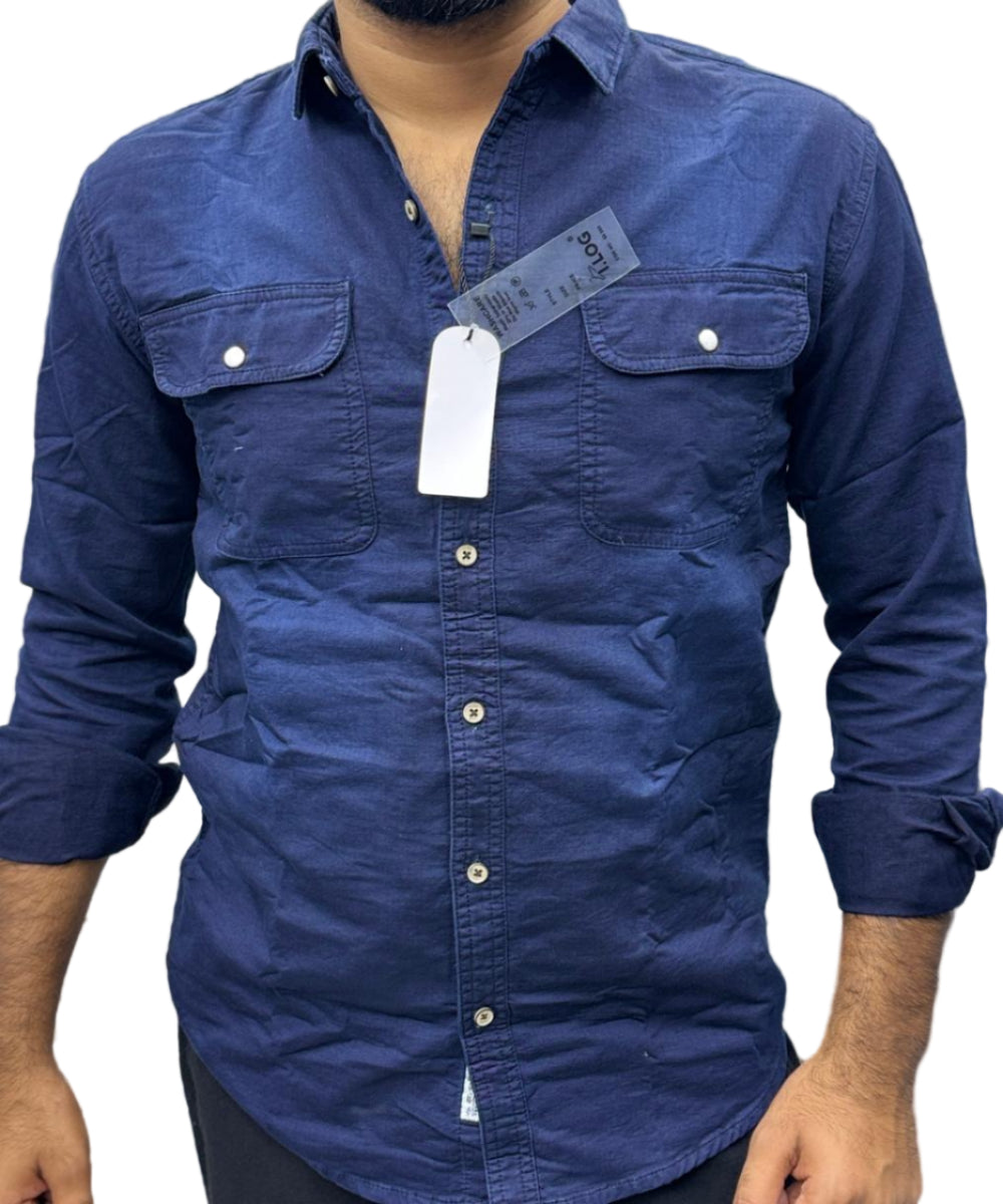 Navy blue shirt with a tag on a blurred background